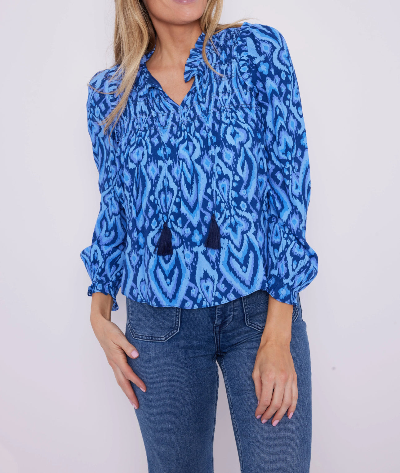 Sail To Sable Blue Ikat Ruffle Neck Top with Tassels